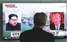  ?? AP ?? A TV screen shows file footage of US President Donald Trump and North Korean leader Kim Jong-un in Seoul. North Korea has threatened to scrap June’s summit with President Trump.