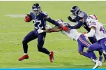  ??  ?? NASHVILLE: Derrick Henry #22 of the Tennessee Titans runs with the ball in the third quarter against the Buffalo Bills at Nissan Stadium on October 13, 2020 in Nashville, Tennessee. —AFP photos