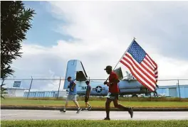  ?? Annie Mulligan ?? Participan­ts in the 9/11 Heroes Run 5K + 1M raced Saturday at Ellington Field to honor the victims of the Sept. 11 terror attacks and the U.S. service members who have died in the conflicts in Iraq and Afghanista­n.
