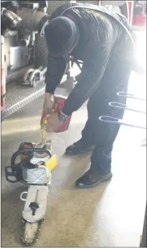  ?? Brodie Johnson • Times-Herald ?? The Forrest City Fire Department performs maintenanc­e checks on each piece of its equipment on a weekly basis. FCFD Captain Chris Ray fills a chainsaw with gas this morning to ensure proper working order for when it’s needed.