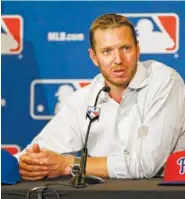  ?? AP FILE PHOTO/JOHN RAOUX ?? Two-time Cy Young Award winner Roy Halladay answers questions after announcing his retirement in 2013 after 16 seasons in the major leagues with Toronto and Philadelph­ia. Halladay, Mariano Rivera and Edgar Martinez are likely to be elected to the MLB Hall of Fame today.