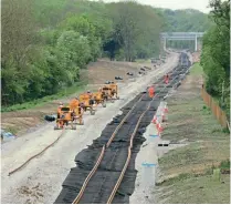  ?? PHIL MARSH ?? HS2 and EWR will work with GBR as it takes over responsibi­lities from the DfT and Network Rail. Track pulling on the EWR route was underway three miles west of Bletchley on May 9.