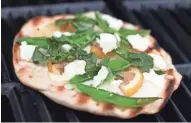  ?? ANNA THOMAS BATES ?? Snap Peas, Lemon and Goat Cheese Grilled Pizza is hot off the grill.