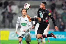  ??  ?? In control Monaco’s French forward Emmanuel Riviere ( right) controls the ball next to Vannes’ defender Thierry Argelier during the French Cup. Monaco eased into the last- 32 with a 3- 2 win.