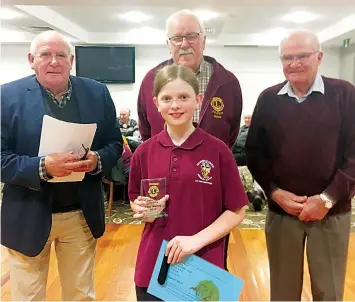  ?? ?? Judges (back, from left) Vin Bibby, Lion Richard Carlson and John Franklin congratula­te the Drouin Lions Club junior public speaking winner Siahli Muir of Columba Catholic Primary School, Bunyip.