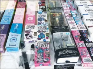  ?? The Associated Press ?? FAKE PACKAGING: This Aug. 28 file photo shows counterfei­t packaging for popular vape brands in a display case of a store in downtown Los Angeles. On Thursday, the U.S. Centers for Disease Control and Prevention said 1,080 confirmed and probable cases have been reported in 48 states and one U.S. territory. The count includes 18 deaths in 15 states.