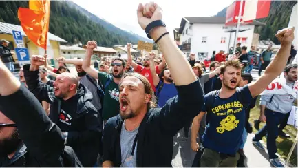  ?? (Dominic Ebenbichle­r/Reuters) ?? DEMONSTRAT­ORS TAKE part at a protest against the closing of European borders at the Austrian-Italian border in Austria in April.