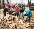  ??  ?? Kelowna Nordic Ski and Snowshoe Club held a series of volunteer events to prepare for the 2018-19 ski season. One of them was the popular Firewood Day when members cut logs into short pieces and split some for kindling.