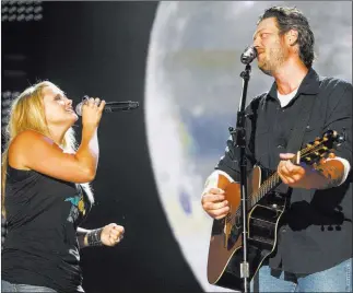  ?? WADE PAYNE/ THE ASSOCIATED PRESS FILE ?? Miranda Lambert and Blake Shelton are shown performing together in 2014. The couple had a dramatic split last year that caused Lambert to re-examine her life.