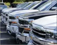  ?? THE ASSOCIATED PRESS ?? Chevrolet trucks are lined up at a Chevrolet dealership in Richmond, Va.