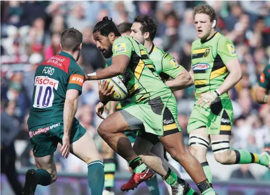  ?? PICTURES: Getty Images ?? Through the gap: Ahsee Tuala hands off George Ford to score for Saints