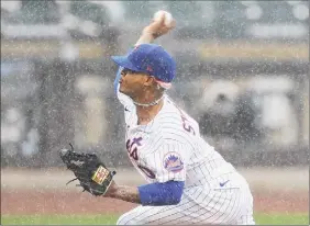  ?? Sarah Stier / Getty Images ?? Marcus Stroman of the New York Mets pitches during the first inning against the Miami Marlins at Citi Field on Sunday in Queens.