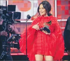  ??  ?? KACEY MUSGRAVES takes home four Grammys, including album of the year.