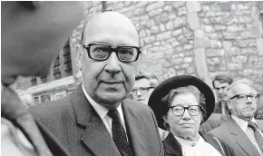  ?? GETTY IMAGES ?? English poet Philip Larkin with his muse and mistress Monica Jones is pictured at the memorial service for Poet Laureate Sir John Betjeman at Westminste­r Abbey, London,in June 1984.