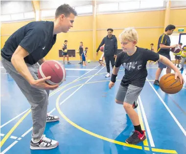  ?? Photo / Ben Fraser ?? Rotorua Intermedia­te pupil Jaden Wright, 12, shows Tall Blacks’ Tom Abercrombi­e his skills at Te Kura Kaupapa Ma¯ori o Te Koutu on Saturday.