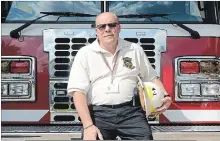  ?? DAVE JOHNSON THE WELLAND TRIBUNE ?? Port Colborne Fire and Emergency Services Deputy Chief Mike Bendia sits on the front of Engine 1. Last Friday was his last day on the job after 41 years of service in the city.