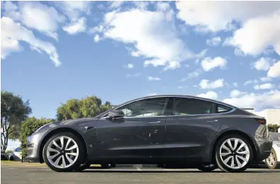  ?? Lea Suzuki / The Chronicle ?? The Tesla Model 3’s upgrade shortened its braking distance and gained approval from Consumer Reports.