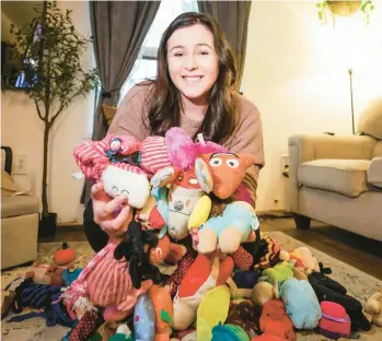  ?? COURTESY ?? Caitlin Parylak is surrounded by her dog toys in her Northeast Philadelph­ia home.