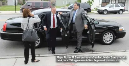  ??  ?? Mayor Richard M. Daley arrives with Sam Roti, head of Daley’s security detail, for a 2010 appearance in West Englewood.
| SUN- TIMES FILES