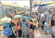  ?? SANTOSH KUMAR/HT ?? Returnees board buses at Danapur station in Patna.