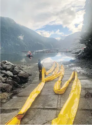  ?? CANADIAN COAST GUARD ?? Boom deployed in Nootka Sound where a 50-year-old shipwreck is leaking oil.