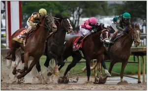  ?? AP/JOHN MINCHILLO ?? Maximum Security (second from right) with Luis Saez runs against Country House (left), War of Will (second from left) and Code of Honor (right) in the Kentucky Derby on May 4. After being disqualifi­ed in the Kentucky Derby, Maximum Security’s owner Gary West has offered to put up as much as $20 million to the owners of Country House, War of Will, Long Range Toddy and Bodexpress if they finish ahead of Maximum Security in a race this year.