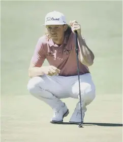  ?? ?? 3 Australia's Cameron Smith lines up a putt on the second green during his final round