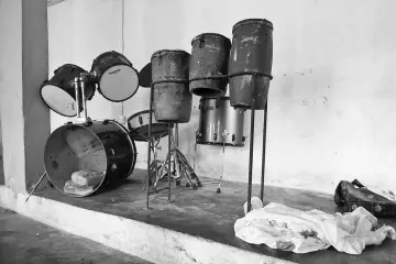  ??  ?? Musical drums arranged in a corner beside blood stained clothes of worshipper­s killed by shadowy gang dubbed the Badoo in the Crystal Church of God at Owode Onirin in Lagos, on July 7. The police in Lagos state said they had arrested and were...