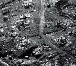  ?? ASSOCIATED PRESS ?? IN THIS SEPT. 28 file photo, debris scatters a destroyed community in the aftermath of Hurricane Maria in Toa Alta, Puerto Rico.