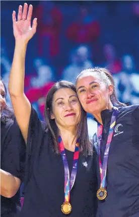  ?? Photo / Getty Images ?? Supercoach Noeline Taurua (left) celebrates ruling the world with Silver Ferns shooter Maria Folau in Liverpool.