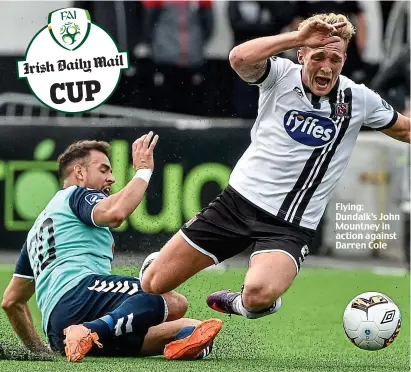  ??  ?? Flying: Dundalk’s John Mountney in action against Darren Cole