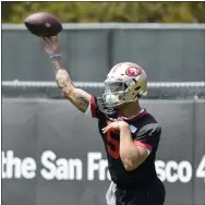  ??  ?? The 49ers’ first-round draft pick quarterbac­k Trey Lance throws during the team’s rookie minicamp in Santa Clara on Friday.