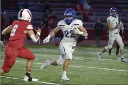  ?? PHOTOS BY SHERRY LAVARS — MARIN INDEPENDEN­T JOURNAL ?? Terra Linda’s Karl Johnson carries the ball against San Rafael during Friday’s MCAL game at San Rafael High. Terra Linda went on to win 28-0.