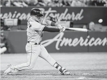  ?? Tom Szczerbows­ki / Getty Images ?? The Astros’ Alex Bregman drives in a run with a double in the third inning, giving him 101 RBIs.