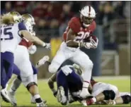  ?? MARCIO JOSE SANCHEZ — THE ASSOCIATED PRESS FILE ?? In this Nov. 10photo, Stanford ‘s Bryce Love (20) runs against Washington during the first half of an NCAA college football game, in Stanford Love was selected to the AP All-Conference Pac-12team announced Thursday.