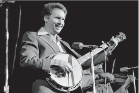  ?? DALE ERNSBERGER/NASHVILLE TENNESSEAN ?? Buck Trent performs during the ABC/Dot Records luncheon and show at the Municipal Auditorium on Oct. 15, 1976.