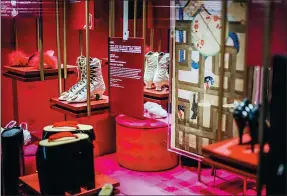 ?? PHOTOS PROVIDED TO CHINA DAILY ?? Top and below: Shoes displayed at the ongoing exhibition, Shoes: Pleasure and Pain, at Taikoo Li, Sanlitun, Beijing. Above: Shoes showcased in the Seduction section of the same exhibition.