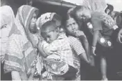  ?? REUTERS ?? Rohingya refugees line up for a food supply distributi­on at the Kutupalong refugee camp near Cox’s Bazar, Bangladesh in December last year.