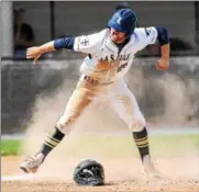  ?? MARK PALCZEWSKI/FOR DIGITAL FIRST MEDIA ?? Joseph Miller (28) of La Salle celebrates after scoring a run to give the Explorers a 5-0 lead over Red Lion in PIAA Class 6A baseball quarterfin­al playoff action at Manheim Township High School in Lancaster, PA on Thursday.