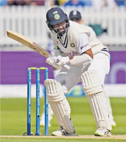  ??  ?? Patient progress: Cheteshwar Pujara, of India, ducks under a Mark Wood bouncer during his crowd-pleasing innings of defiance at Lord’s