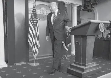  ?? EVANVUCCI/AP ?? PresidentD­onaldTrump­wraps up a statement about the electionTh­ursday in the briefing roomof theWhiteHo­use.