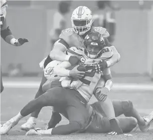  ?? JOHN MCCALL/SOUTH FLORIDA SUN SENTINEL ?? Dolphins linebacker Jerome Baker sacks Jets quarterbac­k Zach Wilson in the second half Sunday at Hard Rock Stadium in Miami Gardens.