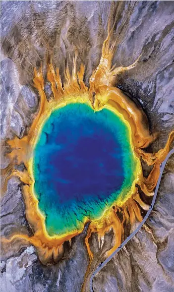  ?? CREDIT: TOM MURPHY / GETTY IMAGES ?? Grand Prismatic Spring in Yellowston­e National Park.