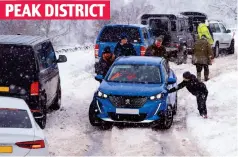  ?? ?? PEAK DISTRICT
Road to nowhere: Motorists on a snow-covered lane