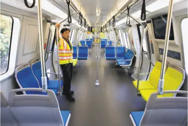  ?? Photos by Michael Macor / The Chronicle ?? Vehicle engineer Rodney Lim rides the rails on one of BART’s new train cars on a demonstrat­ion run at the South Hayward Station. The transporta­tion agency plans to phase into service 775 new cars by 2022.