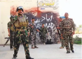  ?? Marwan Ibrahim / AFP / Getty Images ?? Kurdish soldiers deploy in Kirkuk after Islamic State fighters attacked the city. Kurdish forces assumed control of the city in 2014 after Iraqi forces crumbled.