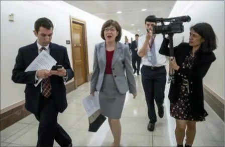  ?? J. SCOTT APPLEWHITE — THE ASSOCIATED PRESS ?? Sen. Susan Collins, R-Maine, a member of the Senate Judiciary Committee, comments on Supreme Court nominee Brett Kavanaugh amid scrutiny of a woman’s claim he sexually assaulted her at a party when they were in high school, on Capitol Hill in Washington, Tuesday.