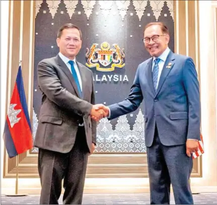  ?? STPM ?? Prime Minister Hun Manet shakes hands with his Malaysian counterpar­t Anwar Ibrahim in Kuala Lumpur on February 27.