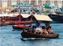  ??  ?? This photo taken in Dubai at Dubai Creek, which is fed by waters from the Arabian Gulf, shows people packed shoulder-to-shoulder as they take in the sights of the historic Bur Dubai and Deira districts.