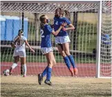  ?? ROBERTO E. ROSALES/JOURNAL ?? Carlsbad’s Alexa Dugan (4) rejoices after scoring the game-winning goal in the final minute to beat AHS for the girls Class 5A soccer title. Abbey Dugan greets her.